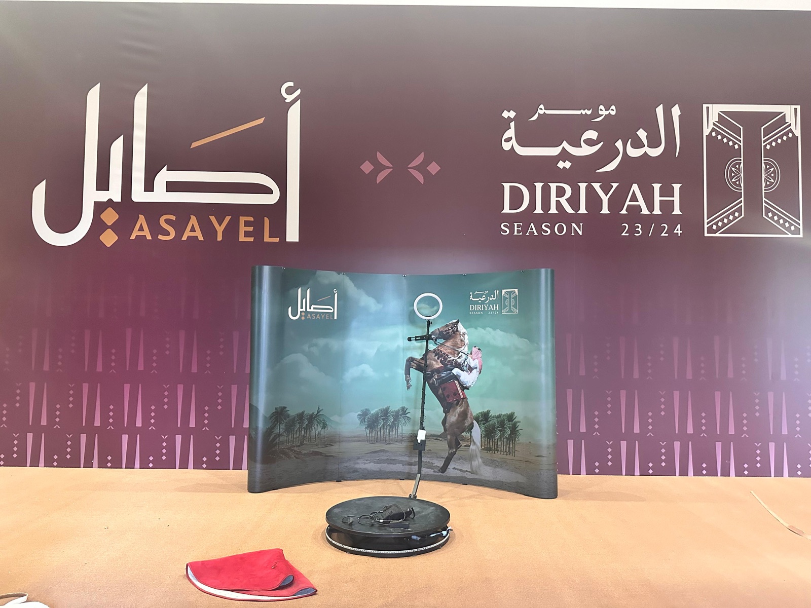 Brand activation exhibition booth with printed backdrop and 360 photo rig installed by Darb for Diriyah Season