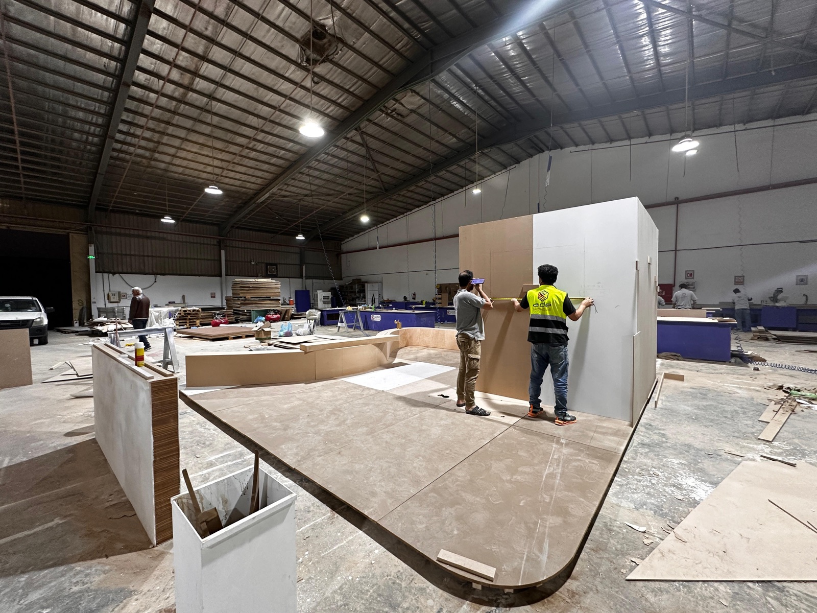 Darb crew building and measuring an exhibition booth for a Riyadh trade show
