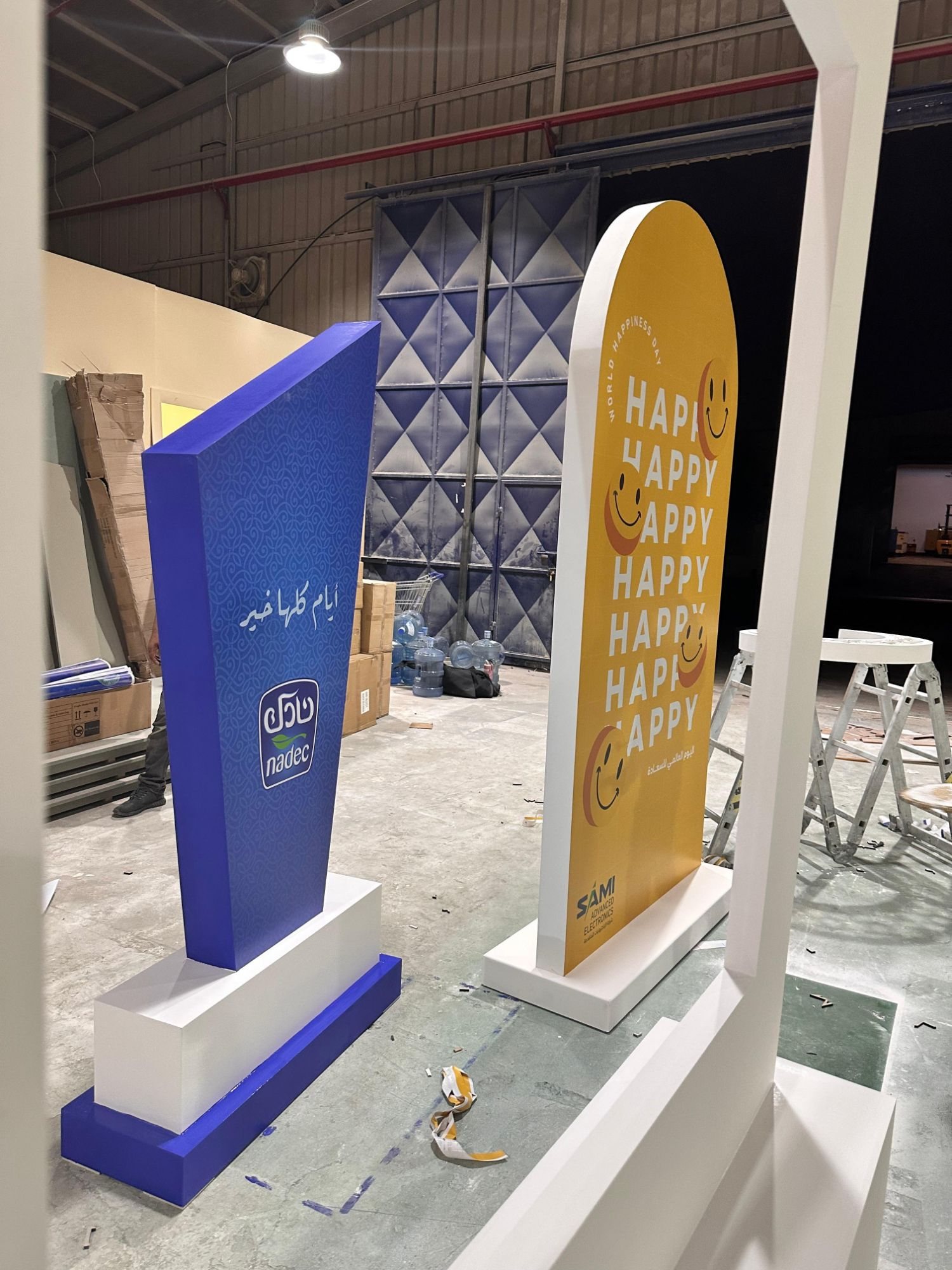 Printed event standees finished on the Darb Productions workshop floor in Riyadh
